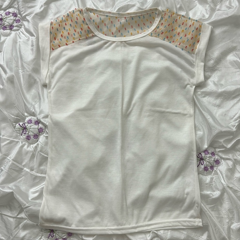 Sleeveless shirt with confetti sheer shoulder